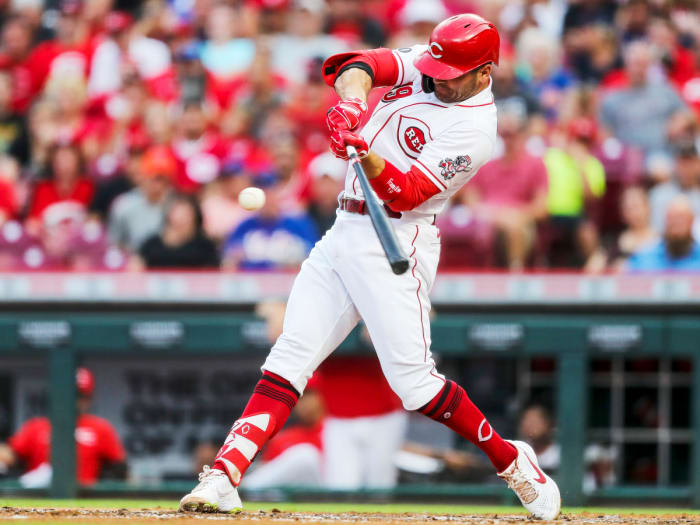 Jul 20, 2021; Cincinnati, Ohio, USA; Cincinnati Reds first baseman Joey Votto (19) hits a solo home run against the New York Mets in the third inning at Great American Ball Park.